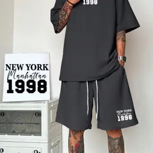 Manfinity Hypemode Erkek Bol Kesim Günlük Harf Baskılı Tişört Ve Şort Takımı