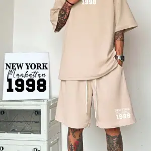 Manfinity Hypemode Erkek Bol Kesim Günlük Harf Baskılı Tişört Ve Şort Takımı