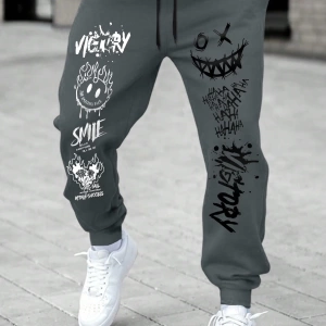 Erkek Karikatür Yüz ve Harf Baskılı Bağcıklı Jogger Pantolon