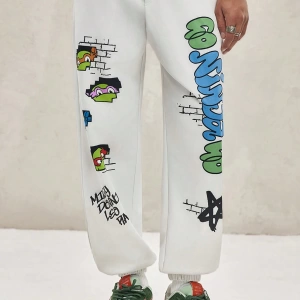 TEENAGE MUTANT NINJA TURTLES X SHEIN Erkek Rahat Bol Grafik Baskılı Beyaz Jogger Eşofman Altı