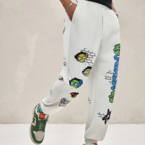 TEENAGE MUTANT NINJA TURTLES X SHEIN Erkek Rahat Bol Grafik Baskılı Beyaz Jogger Eşofman Altı