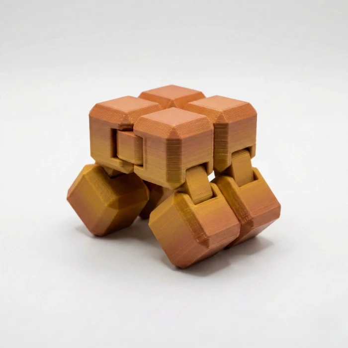 Premium İpek Dokulu Sonsuzluk Küpü (Infinity Cube) - Stres Giderici & Odaklanma Oyuncağı - Bakır/Altın Geçişli