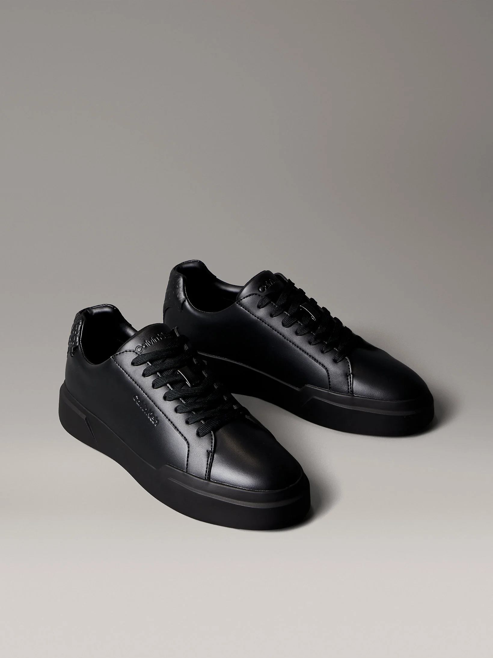 Calvin Klein Chunky Cupsole Bağcıklı Deri Tamamı Baskılı Erkek Siyah Sneaker HM0HM02070-0GJ