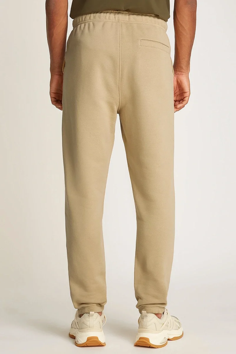 Tommy Hilfiger TJM REG BADGE SWEATPANT Erkek BEJ Eşofman Altı DM0DM20276ACT