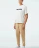 Tommy Jeans TJM REG BADGE JOGGER Erkek Bej Eşofman Altı DM0DM18355AB9