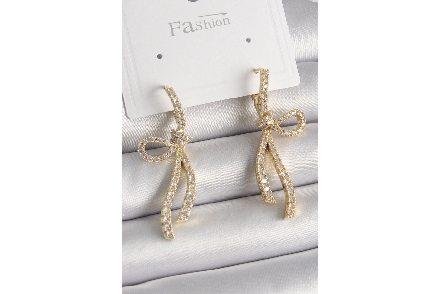 Shoecide Pirinç Gold Renk Zirkon Taşlı Kurdele Model Kadın Küpe