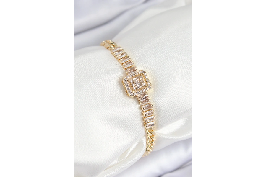Shoecide Pirinç Zirkon Taşlı Su Yolu Detaylı Baget Model Gold Renk Kadın Bileklik