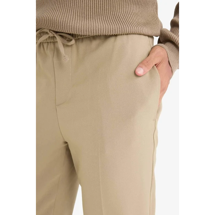 Defacto A9943 Bej Yazlık Kumaş Jogger Pantolon Beli Bağcıklı Lastikli Düz Paça Cepli Her Yöne Esneyen