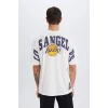 Defacto B3894 Ekru DeFactoFit NBA Los Angeles Lakers Oversize Geniş Kalıp Bisiklet Yaka Kısa Kollu Tişört