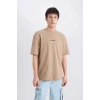 Defacto D5619 Bej One Piece Boxy Fit Bisiklet Yaka Sırt Baskılı Kısa Kollu Tişört