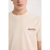 Defacto D6783 Bej Avatar the Last Airbender Regular Fit Bisiklet Yaka Baskılı Kısa Kollu Tişört