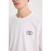 Defacto D5581 Beyaz Oversize Geniş Kalıp Bisiklet Yaka Sırt Baskılı Kısa Kollu Tişört