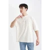 Defacto C2732 Ekru Loose Fit Bisiklet Yaka Sırt Baskılı Kısa Kollu Tişört