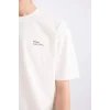 Defacto E0910 Ekru %100 Pamuk Boxy Fit Bisiklet Yaka Sırt Baskılı Kısa Kollu Tişört