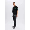 Defacto D6692 Siyah DeFactoFit NBA Milwaukee Bucks Kalın Jogger Eşofman Altı Standart Fit Cepli Beli Bağcıklı Lastikli Paça