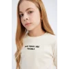 Defacto D8565 Ekru Kız Çocuk Slim Fit Dar Kesim Bisiklet Yaka Baskılı Fitilli Kaşkorse Uzun Kollu Tişört