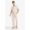 Defacto E4790AXER22 Ekru Relax Fit Kısa Paça Keten Görünümlü Beli Bağcıklı Lastikli Cepli Pantolon