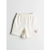 XSIDE Bej Beli Lastikli New York Baskılı Kadın Şort