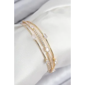 Pirinç Zirkon Taşlı Su Yolu Model Gold Renk Kadın Bileklik