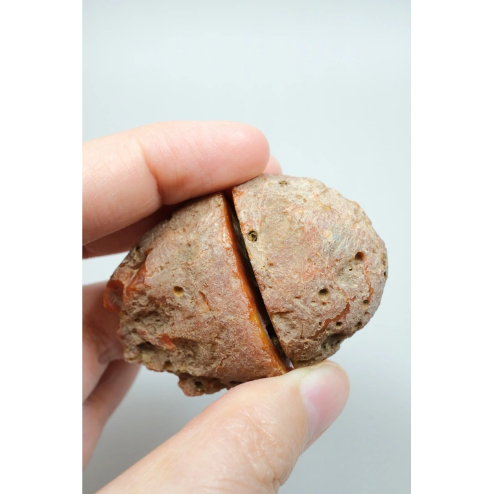カーネリアンレッドとバーントオレンジの縞模様が入った黒海瑪瑙のペア、パープルアイ瑪瑙