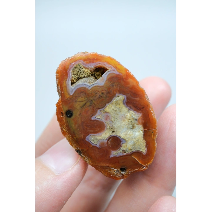 カーネリアンレッドとバーントオレンジの縞模様が入った黒海瑪瑙のペア、パープルアイ瑪瑙