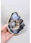 蓝靛蓝梅林石独石，274克，其中有散漂的动态片段在结晶空腔内浮动