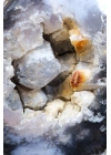 蓝靛蓝梅林石独石，274克，其中有散漂的动态片段在结晶空腔内浮动