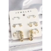 Nevamel® Pirinç Gold Renk Zirkon Taşlı Sarmal Halka Model 7Li Kadın Küpe Seti 5886