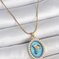 BUĞZ 316L Çelik Gold Renk Zincir Mavi Mineli İncili Zirkon Taşlı Çiçek İşlemeli Portre Model Kadın Kolye