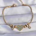 BUĞZ 316L Çelik Gold Renk Zirkon Taşlı Nazarlı Kalp Tasarımlı Bileklik
