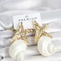 BUĞZ Doğal Deniz Kabuğu ve Gold Renk Yıldız Model Kadın Küpe