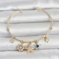 BUĞZ Gold Renk Pirinç Deniz Tema Charmlı Kadın Bileklik