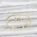 BUĞZ Pirinç Gold Renk Baget Zirkon Taşlı Objeli Kadın Bileklik