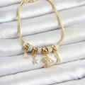 BUĞZ Pirinç Gold Renk Charmlı Kadın Bileklik