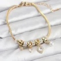 BUĞZ Pirinç Gold Renk Kalp Charmlı Kadın Bileklik