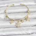 BUĞZ Pirinç Gold Renk Lotus Detay Charmlı Kadın Bileklik