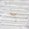 BUĞZ Pirinç Gold Renk Minimal Sallantılı Yıldız Model Kadın Kolye