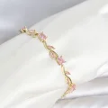 BUĞZ Pirinç Gold Renk Pembe Zirkon Taşlı Çiçek Model Kadın Bileklik