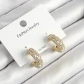 BUĞZ Pirinç Zirkon Taşlı Halka Model Gold Renk Kadın Küpe