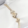 BUĞZ Pirinç Zirkon Taşlı Kalp Model Gold Renk Kadın Bileklik