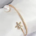 BUĞZ Pirinç Zirkon Taşlı Yıldız Ve İnci Model Gold Renk Kadın Bileklik