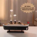 BUĞZ Sıcak ve soğuk buhar seçenekli, oda havasını nemlendiren cihaz. Siyah renklidir.