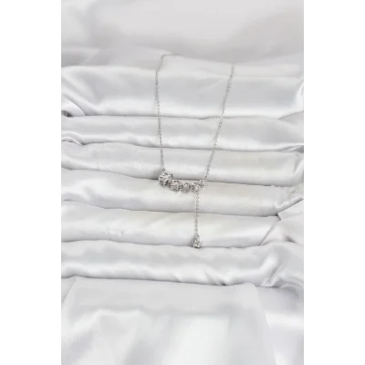 BUĞZ Pirinç Gümüş Renk Minimal Sallantılı Yıldız Model Kadın Kolye - BUĞZ