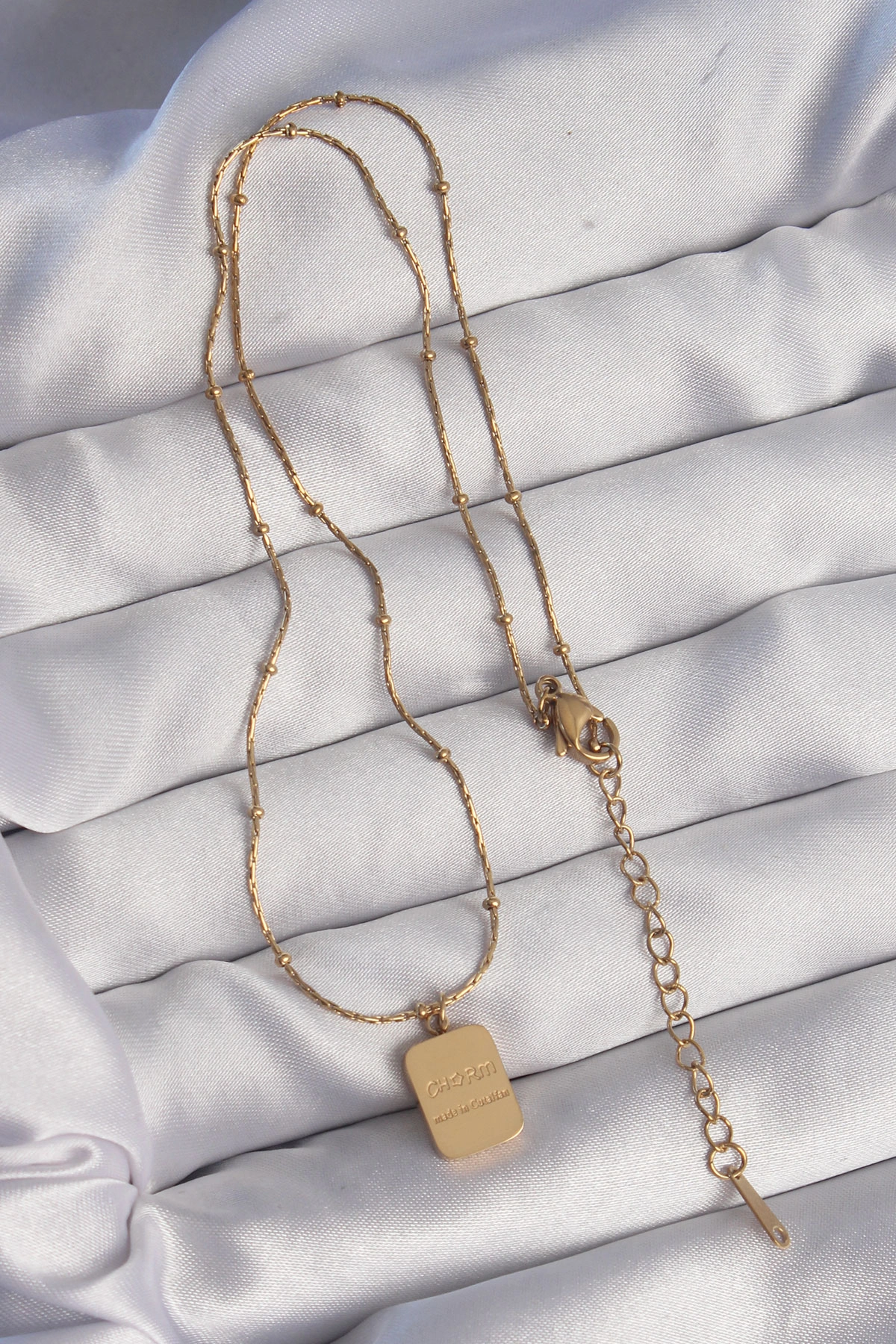BUĞZ 316L ÇELİK GOLD RENK KARE CHARM MODEL KOLYE - BUĞZ BUĞZ 316L ÇELİK GOLD RENK KARE CHARM MODEL KOLYE - BUĞZ
