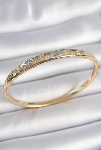 Pirinç Gold Renk Mavi Zirkon Taşlı Kelebek İşlemeli Kadın Kelepçe - Lisinya