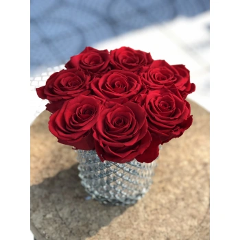 Red Shocking Roses in a Crystal Glass Vase
