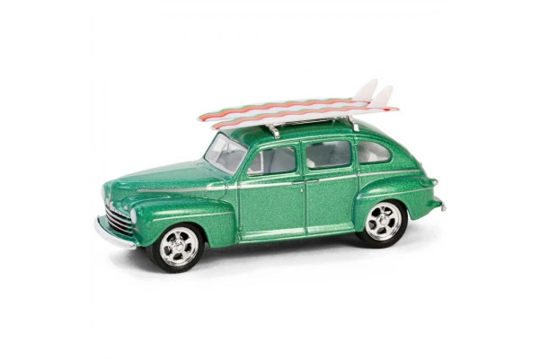 Greenlight 1/64 The Hobby Shop Series 16 - 1946 Ford Fordor Super Deluxe Green Metallic with White Interior and Roof Rack with Surfboards