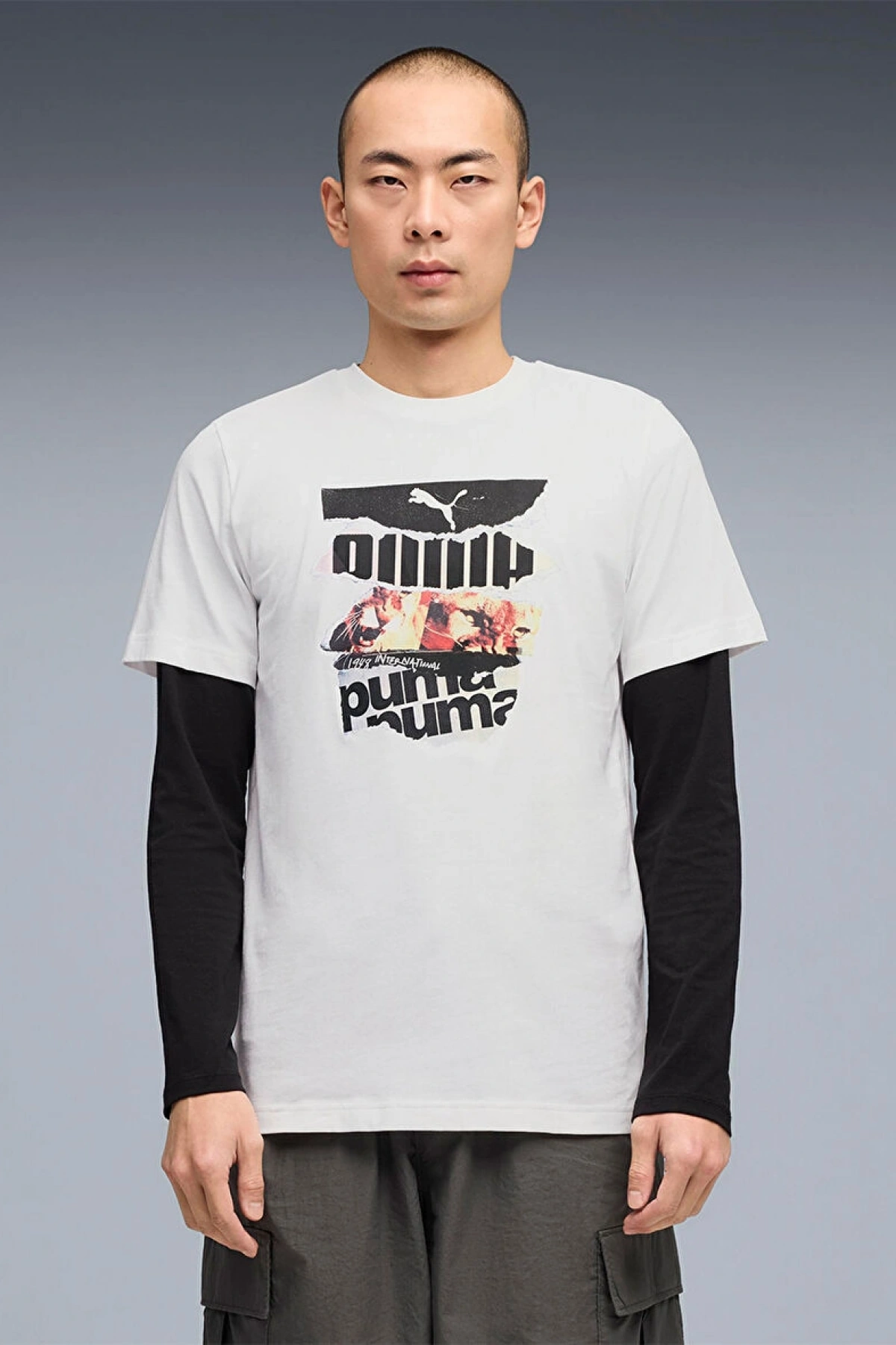 PUMA marka, %100 pamuktan üretilmiş, erkekler için spor tarzı, grafik baskılı tişört.