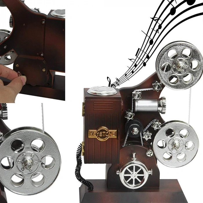 علبة موسيقى بتصميم آلة عرض سينمائية