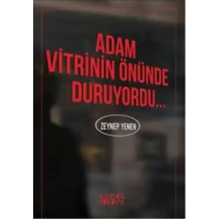 Adam Vitrinin Önünde Duruyordu